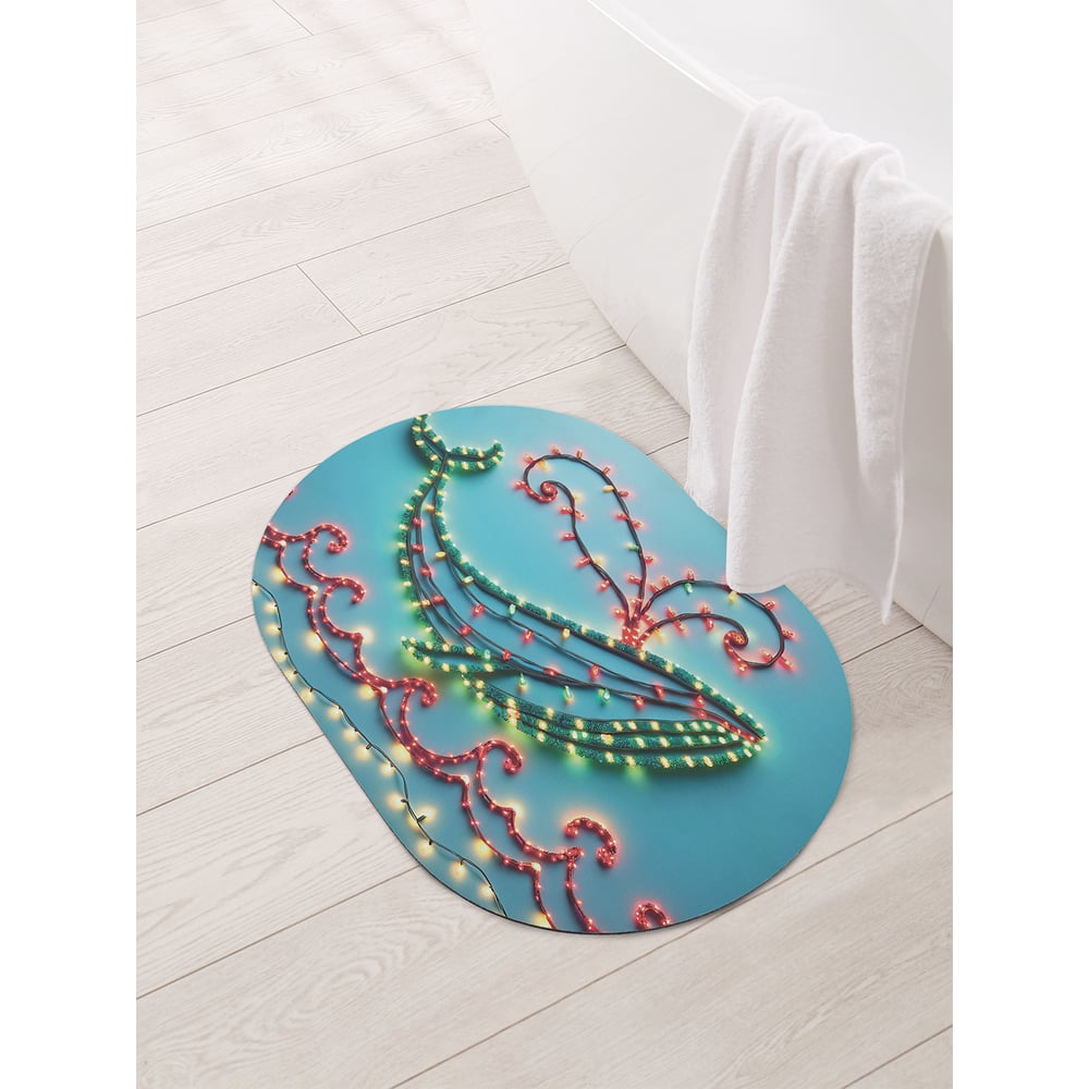 Изображение товара Овальный коврик для ванной JoyArty Кит в огоньках 58x38 см с противоскользящим покрытием