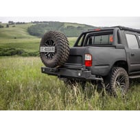 Бампер силовой задний STC Toyota Hilux 1997-2004 с квадратом под фаркоп, кронштейном крепления запасного колеса по центру и кронштейном крепления гос номера и фарами заднего хода/ПТФ STC-TH97-BR-C1-L2