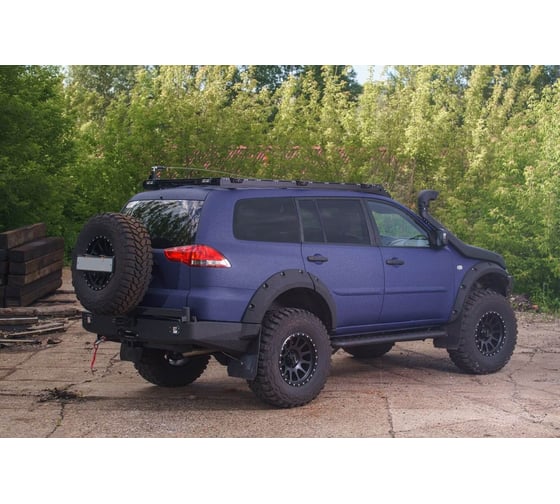 Бампер силовой задний STC Mitsubishi Pajero Sport 2008-2015 c квадратом под фаркоп, площадкой под лебедку, кронштейном крепления запасного колеса по центру и кронштейном крепления гос номера STC-MPS2-BR-W-C1